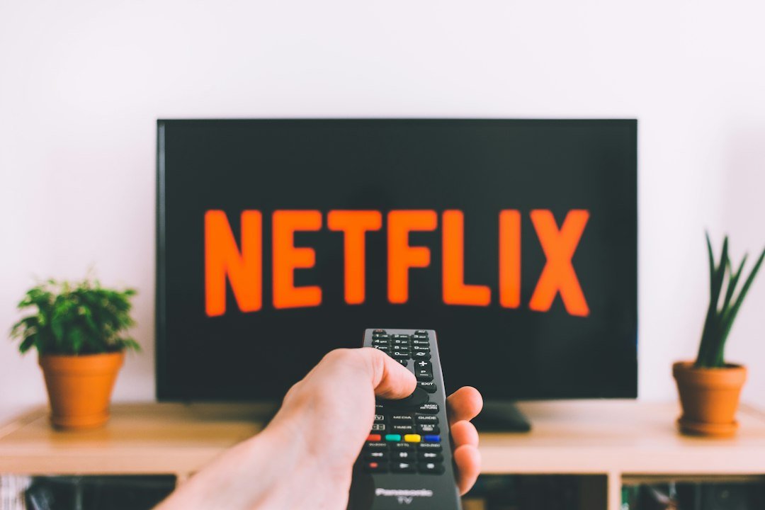 Person holding a TV remote while using a streaming device